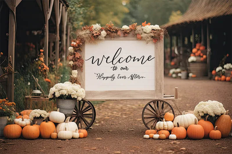 Welcome sign in hand lettering outside surrounded by pumpkins